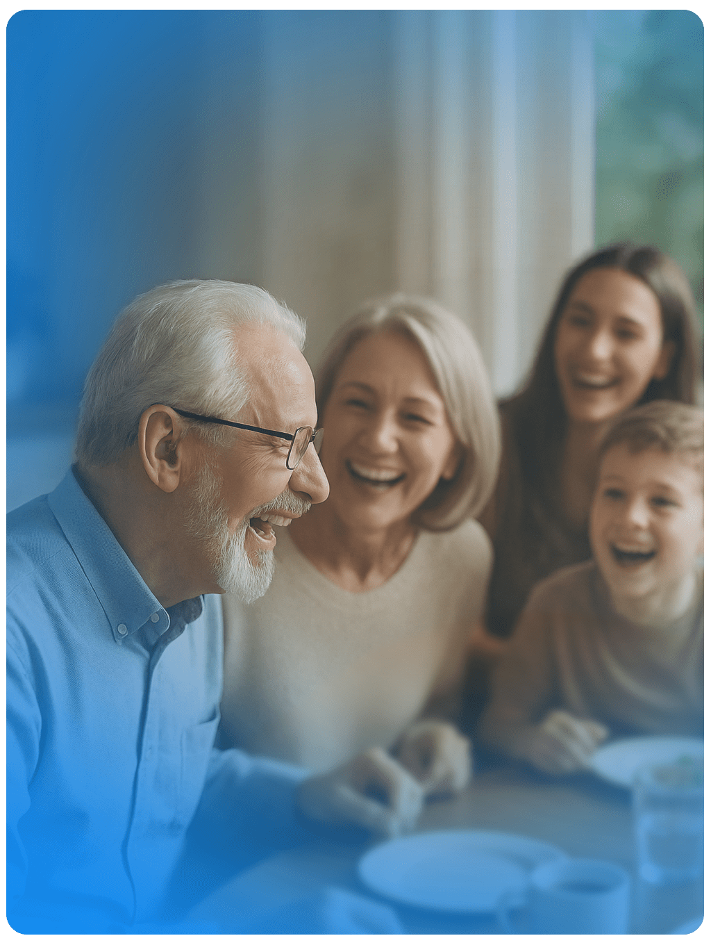 Family of four laughing together at a table with a blurred blue brand overlay